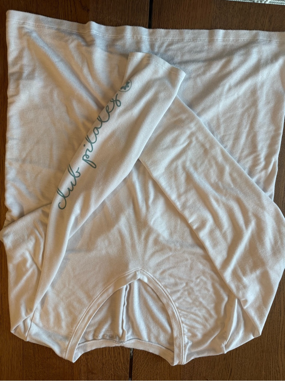 Beyond Yoga White Long Sleeve Lace Back Top with Teal Script on Sleeve